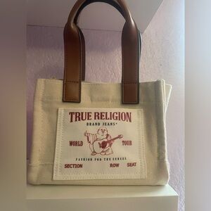 Small true religion bag, new never used.